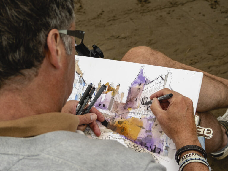 Ian Fennelly Sketching Robin Hoods Bay